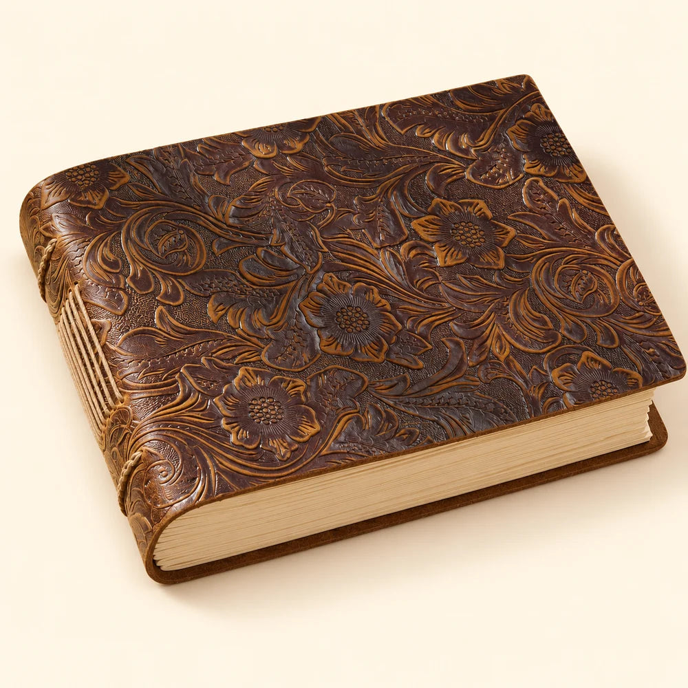 Canyon Bloom landscape cowhide leather journal with a brown floral-patterned cover and exposed stitching.