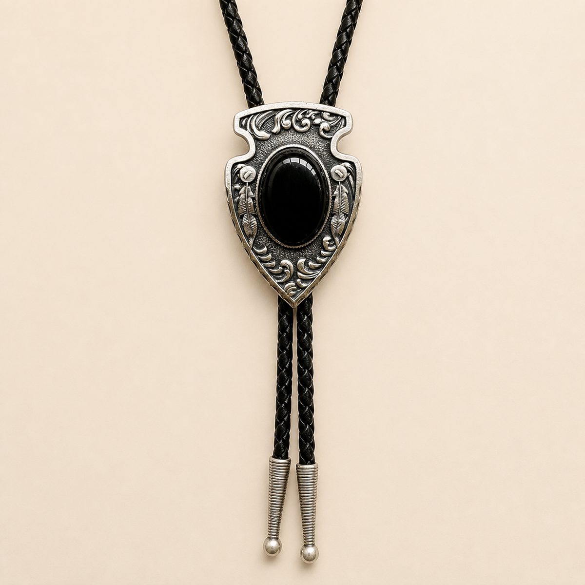 Arrowhead Black Obsidian Silver Bolo Tie on warm ivory background