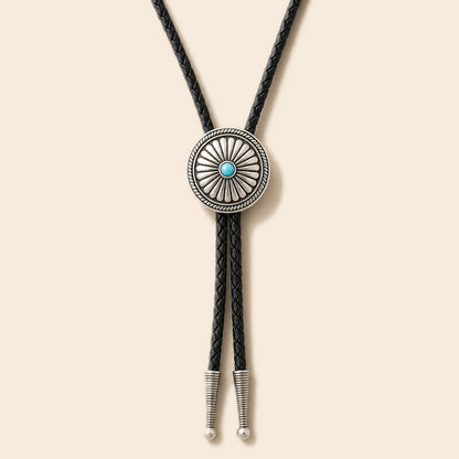 Daisy turquoise sterling silver bolo tie on a warm ivory background