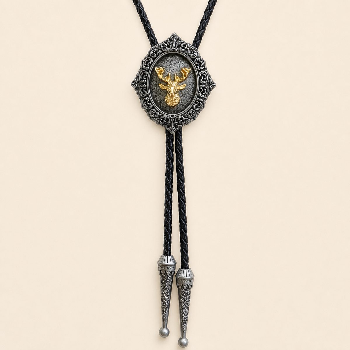 Gilded stag antique silver bolo tie with braided leather cord and engraved silver tips on warm ivory