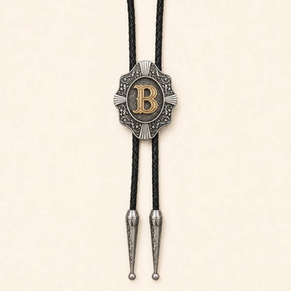 Gold letter B Western bolo tie on a warm ivory background