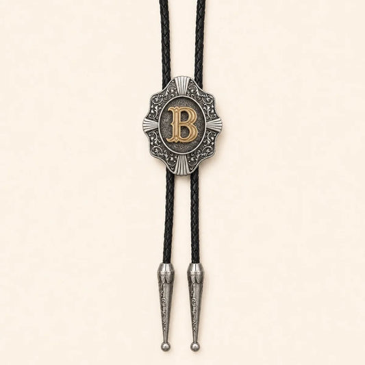 Gold letter B Western bolo tie on a warm ivory background