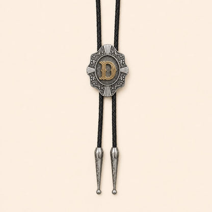 Gold letter D Western bolo tie on a warm ivory background
