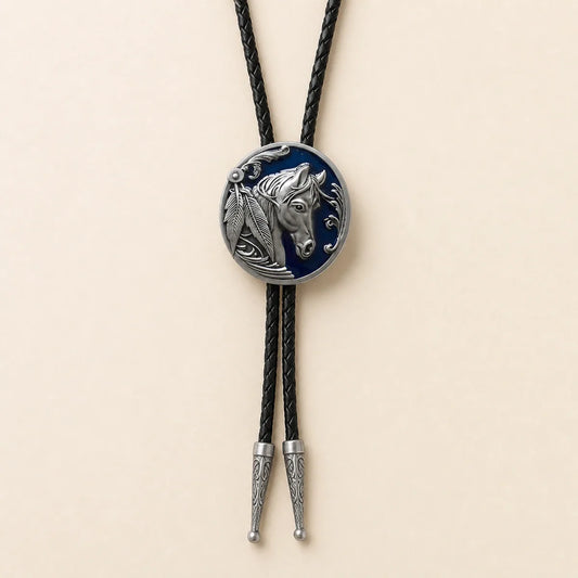Midnight blue horse head bolo tie with navy enamel medallion on warm ivory background