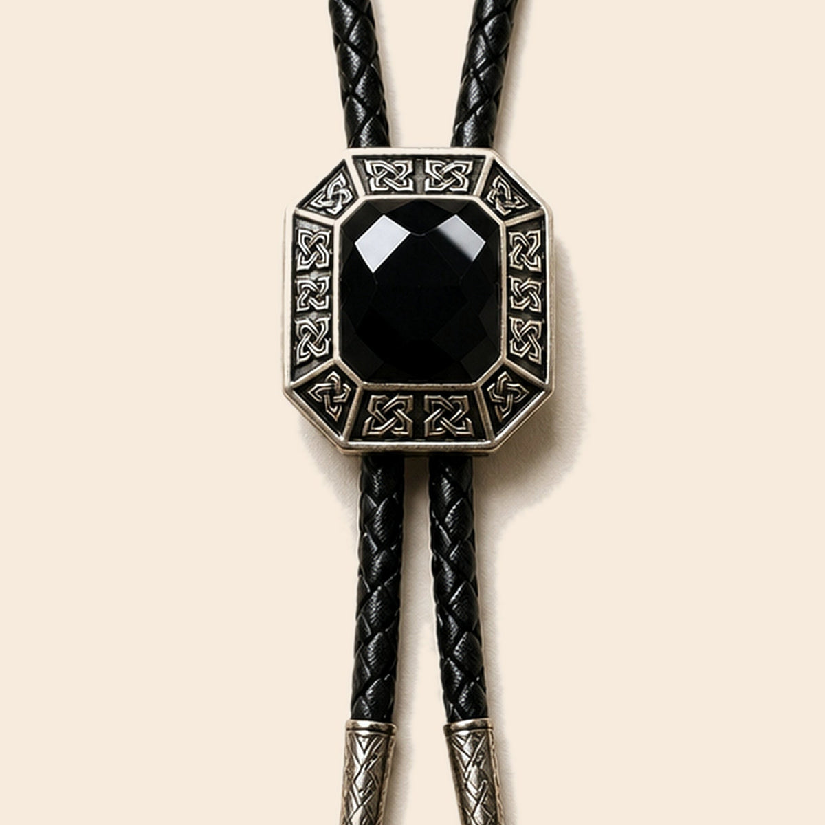 Shadow Ridge black onyx bolo tie with geometric antique silver frame on a warm ivory background
