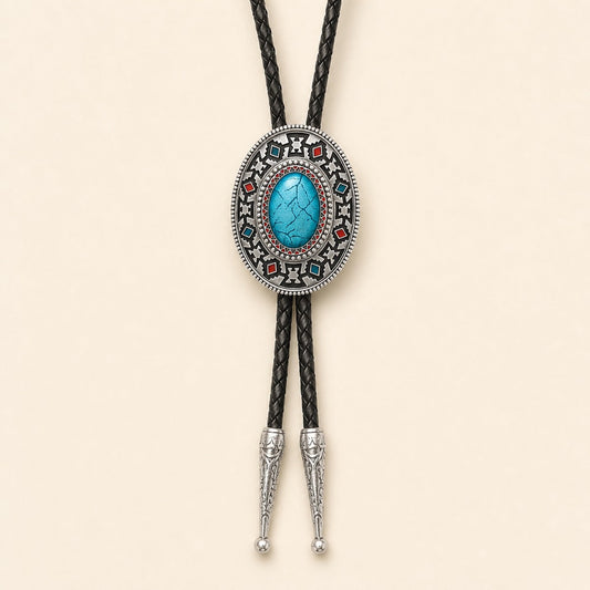 Southwestern enamel bolo tie with blue and red geometric concho on a warm ivory background