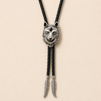 Stainless steel red inlay wolf head bolo tie with black braided leather cord and feather-shaped tips