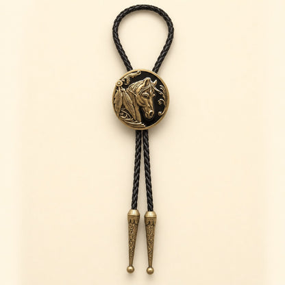 Western horse head copper bolo tie with braided leather cord on warm ivory background
