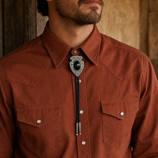 Arrowhead Black Obsidian Silver Bolo Tie worn with rust western shirt