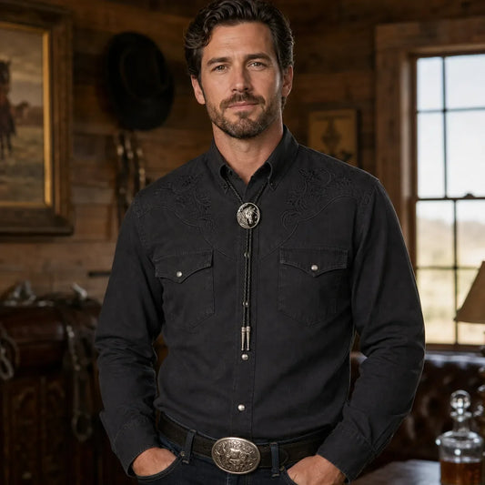 Black horse head bolo tie worn with a dark Western shirt