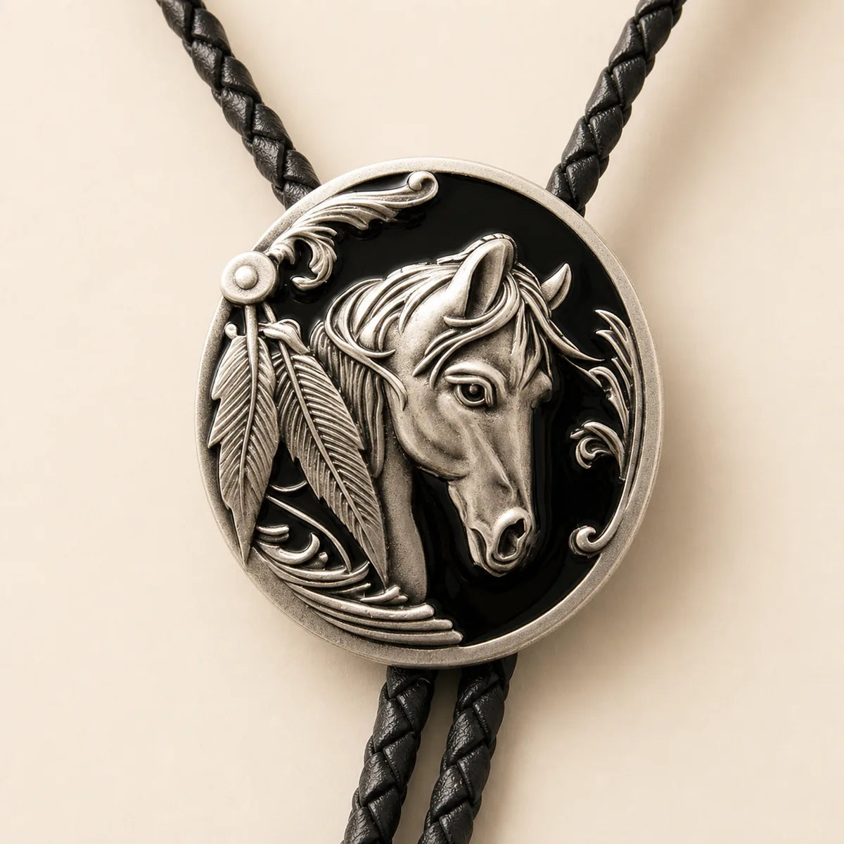 Close-up of black enamel horse head bolo tie medallion
