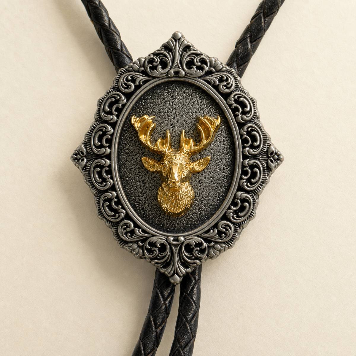 Macro detail of gold stag head on ornate antique silver bolo tie centerpiece