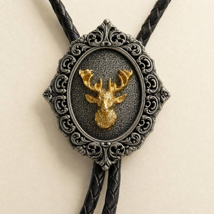Macro detail of gold stag head on ornate antique silver bolo tie centerpiece