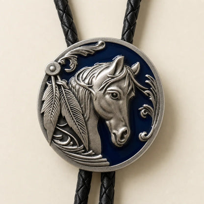 Close-up of antique silver horse head bolo tie with deep blue enamel