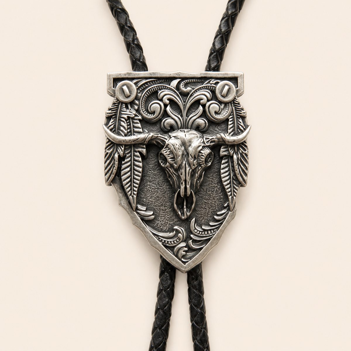 Close-up of the silver longhorn arrowhead centerpiece with feather and scrollwork details