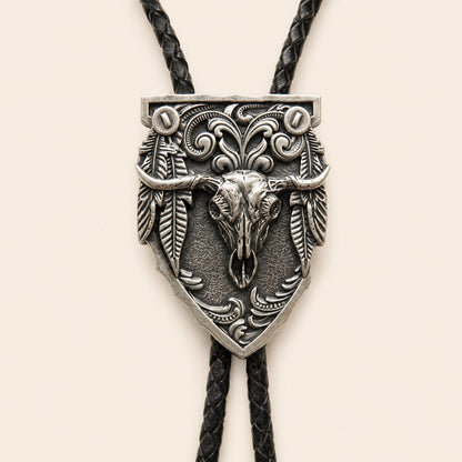 Close-up of the silver longhorn arrowhead centerpiece with feather and scrollwork details