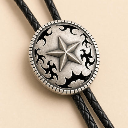 Close detail of raised five-point star silver bolo concho