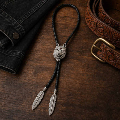 Stainless steel red inlay wolf head bolo tie on a western walnut wood flat lay