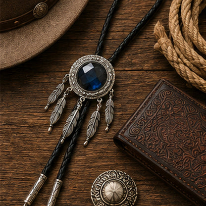 Labradorite dreamcatcher bolo tie flat lay with rustic western leather accessories