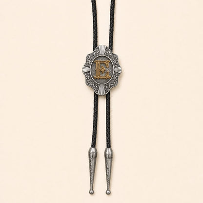Gold letter E Western bolo tie on warm ivory background