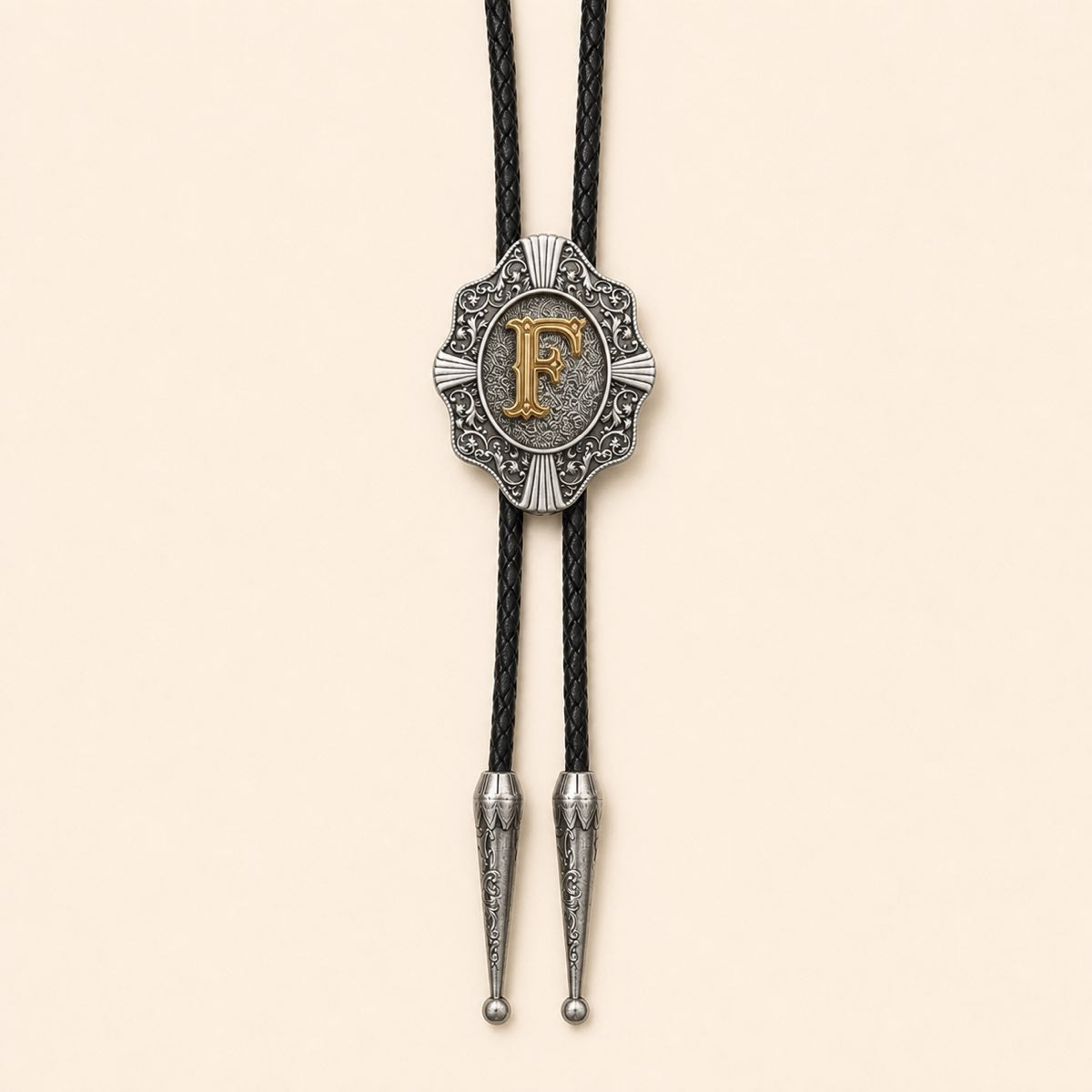 Gold letter F Western bolo tie on warm ivory background