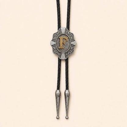 Gold letter F Western bolo tie on warm ivory background