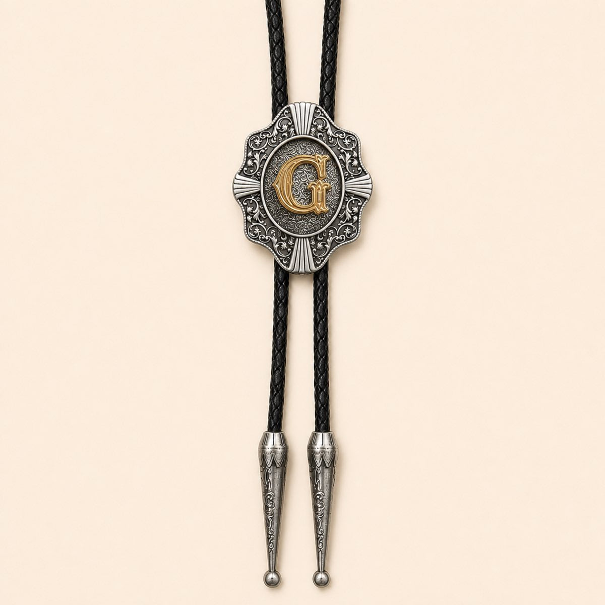 Gold letter G Western bolo tie on warm ivory background