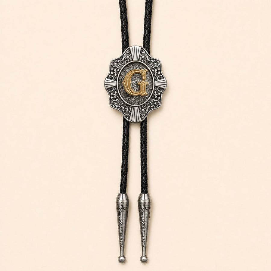 Gold letter G Western bolo tie on warm ivory background