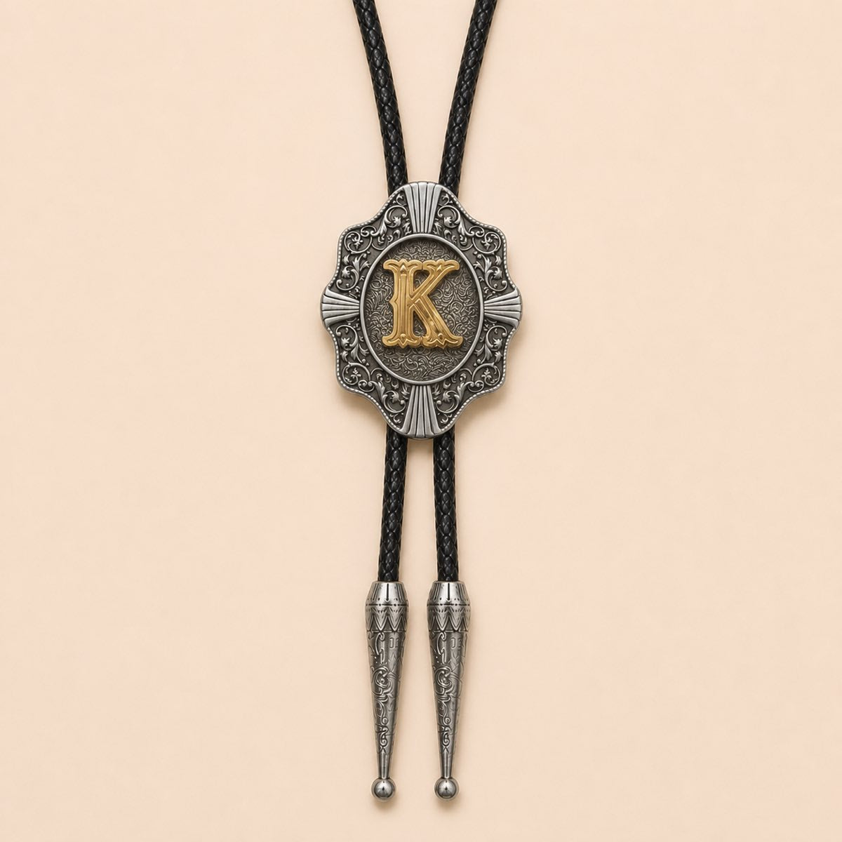 Gold letter K Western bolo tie full product on warm ivory background