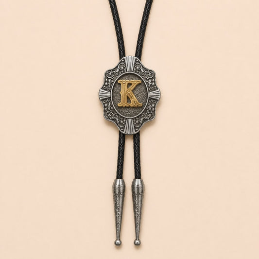 Gold letter K Western bolo tie full product on warm ivory background