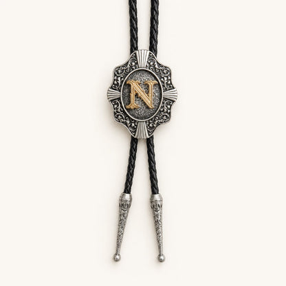 Gold letter N western bolo tie on ivory background