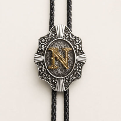 Gold letter N bolo tie engraved metal detail