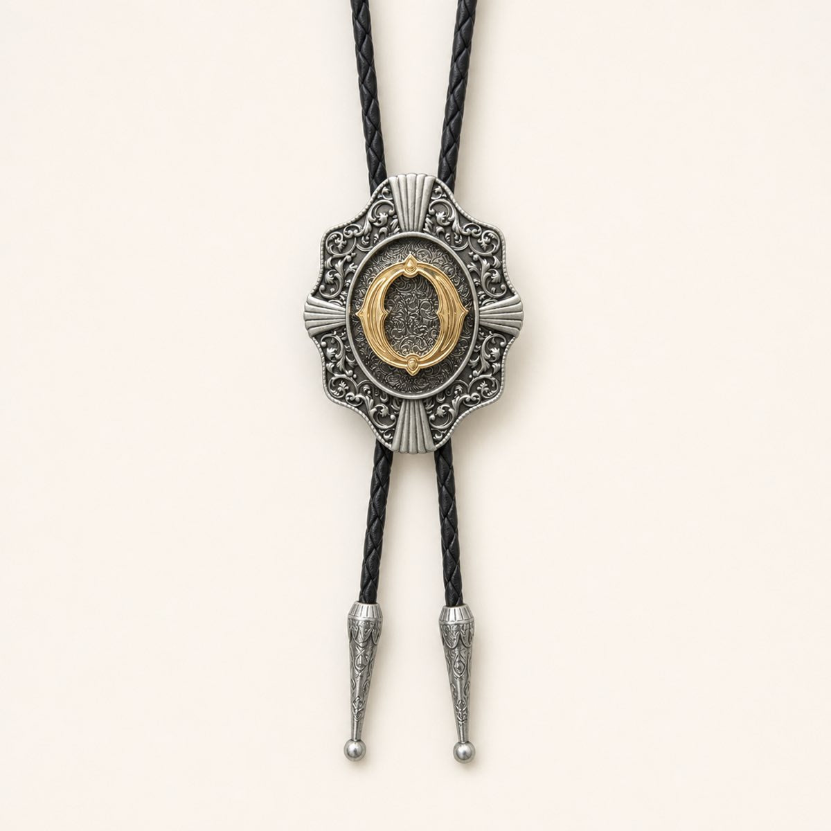Gold letter O western bolo tie on ivory background