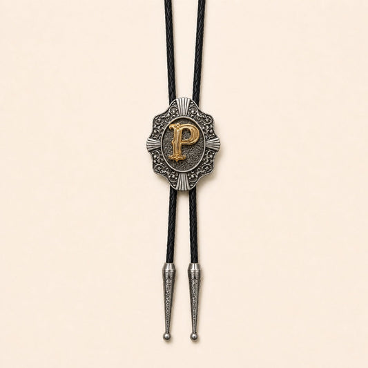 Gold letter P western bolo tie on pale warm ivory background
