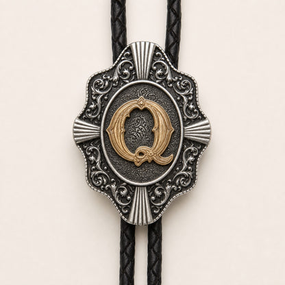 Gold letter Q bolo tie engraved metal craftsmanship detail