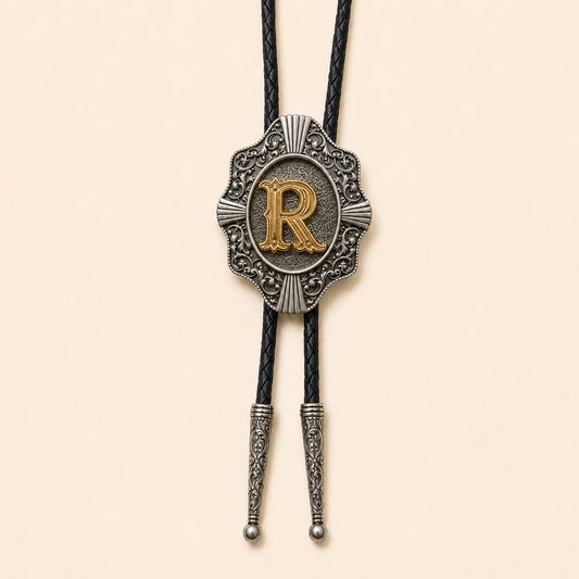 Gold letter R western bolo tie on pale warm ivory background
