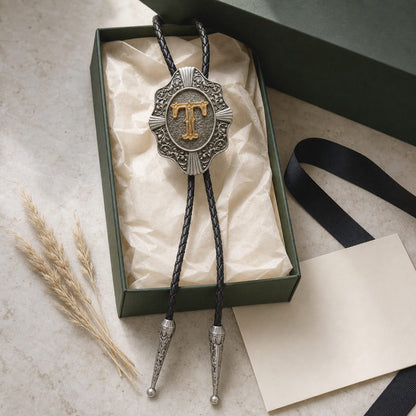 Gold letter T bolo tie presented as a personalized gift