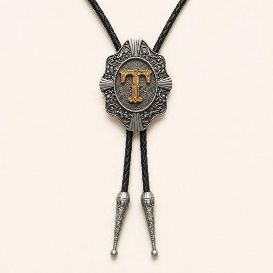 Gold letter T western bolo tie on pale warm ivory background