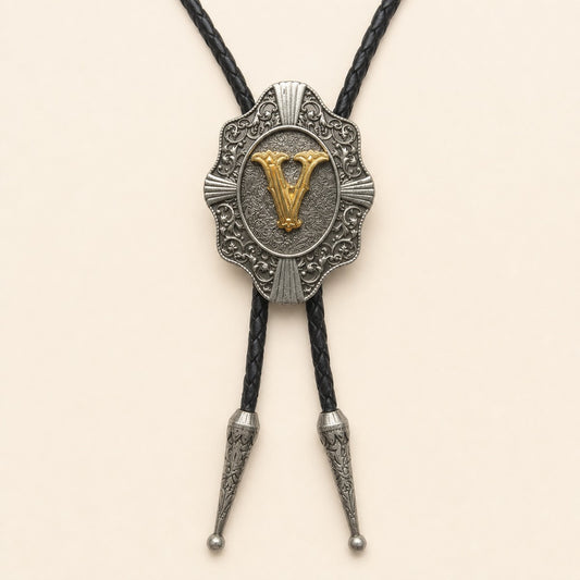 Gold letter V western bolo tie on pale warm ivory background