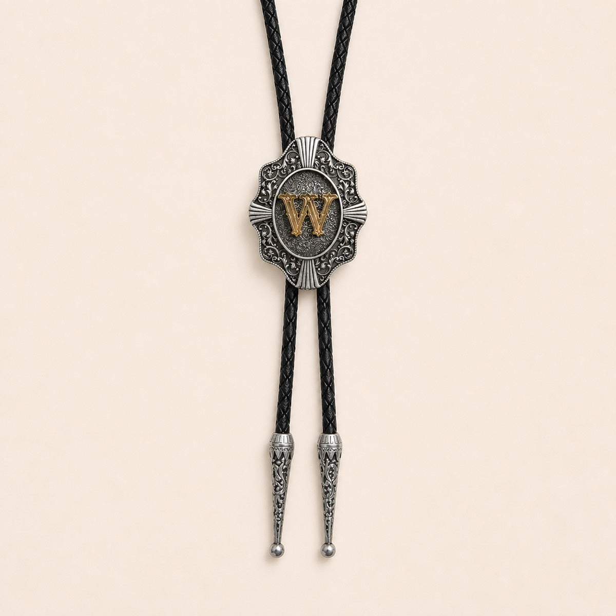 Gold letter W western bolo tie on pale warm ivory background