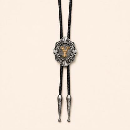 Gold letter Y western bolo tie on pale warm ivory background