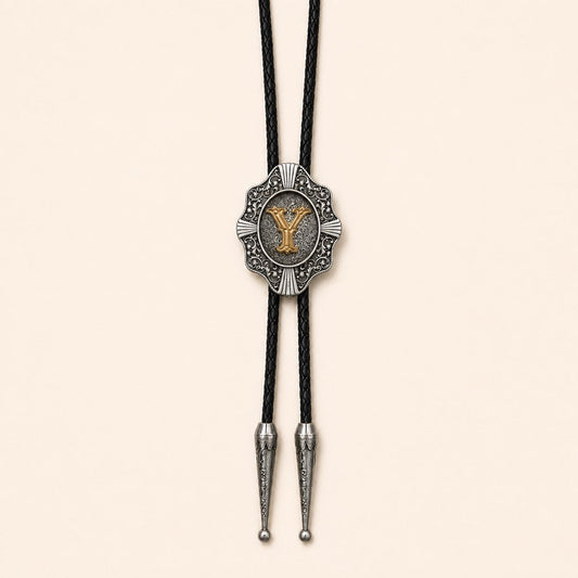 Gold letter Y western bolo tie on pale warm ivory background