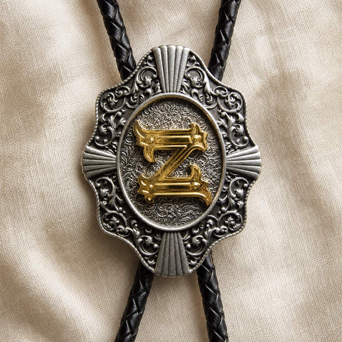 Gold letter Z bolo tie antique silver engraving and leather detail