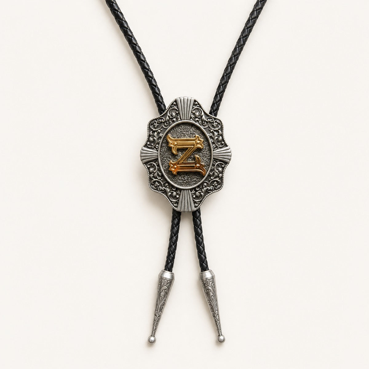 Gold letter Z western bolo tie on pale warm ivory background