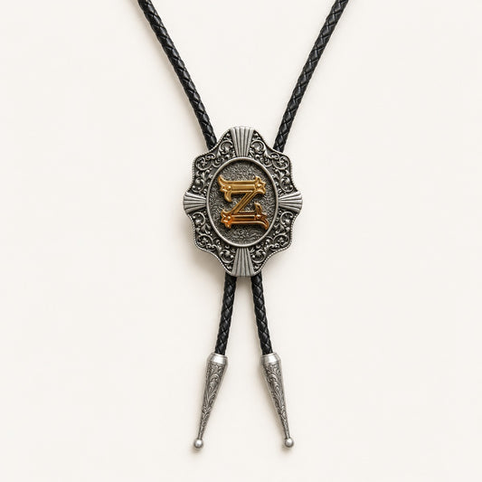 Gold letter Z western bolo tie on pale warm ivory background